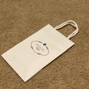 Prada paperbag with ribbon and a card